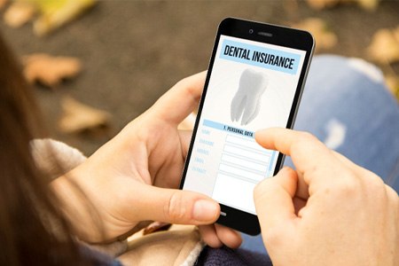 Checking dental insurance information on phone