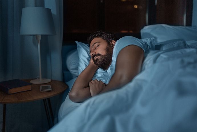 a man sleeping in a bed