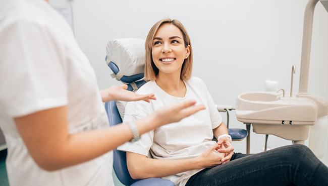 woman talking to her dentist 