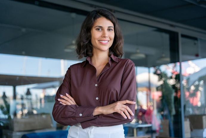 Smiling, confident woman wearing business attire