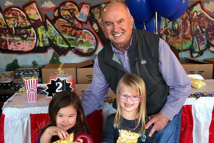 Doctor Drennan with two young patients at community event