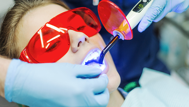 Woman receiving dental bonding treatment