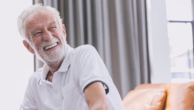 An elderly man enjoying his dentures in Fort Worth