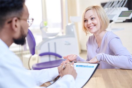 a patient asking about the cost of tooth extractions 