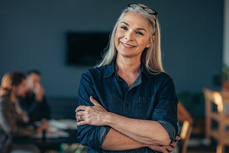 woman smiling with benefits of dental implants in Fort Worth