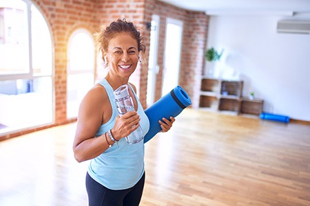 woman exercising with benefits of dental implants in Fort Worth