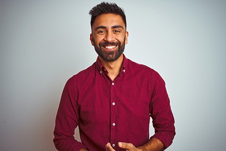 Smiling bearded man in a button-up shirt