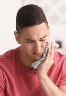 man with tooth pain in the Westover Hills area