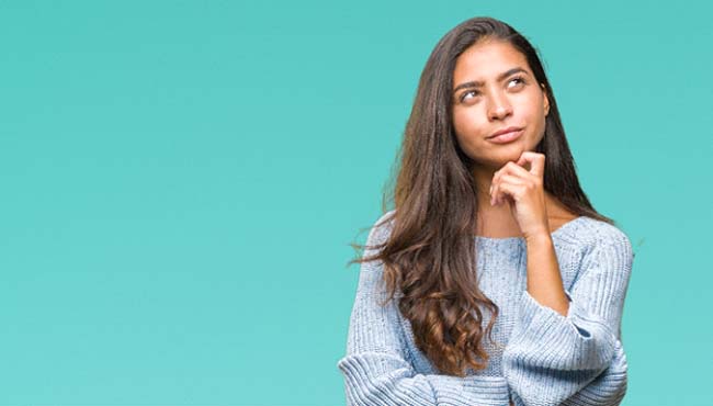 Woman wondering about Lumineers in Fort Worth on blue background