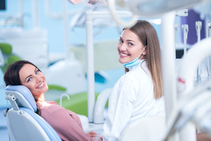 Woman at dentist for metal-free restorations in Ft. Worth