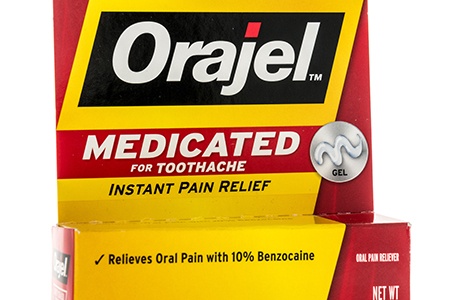 A tube of Orajel topical oral pain relief gel
