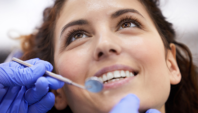 Woman smiling after pulp therapy