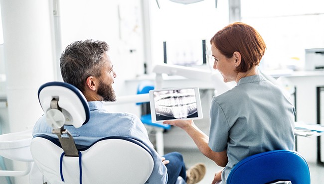 dentist talking to patient 