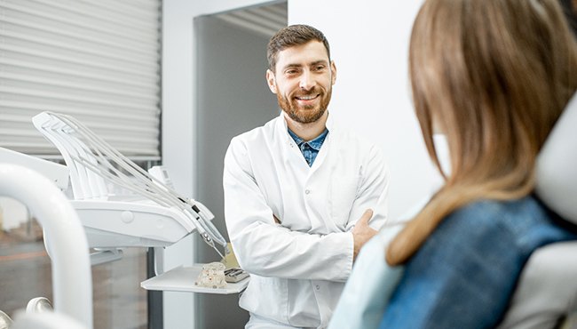 dentist talking to patient