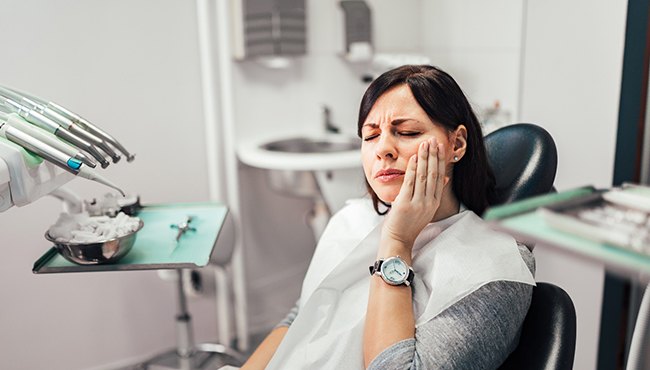 woman with dental implant pain