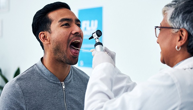 A man getting an oral cancer screening