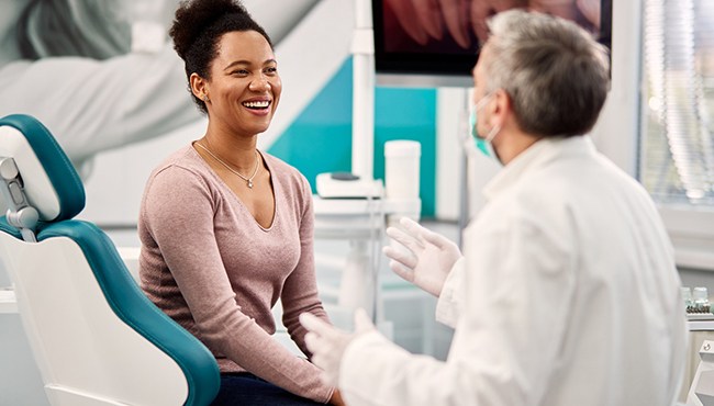A dentist discussing an oral cancer screening