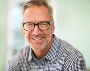 Man sharing flawless smile after cosmetic dentistry