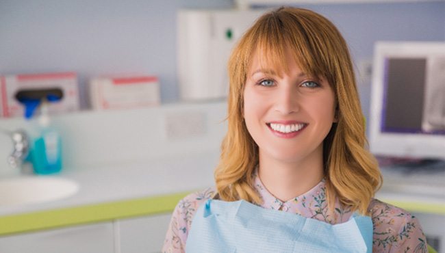 Woman smiling after TMJ therapy in Fort Worth, TX