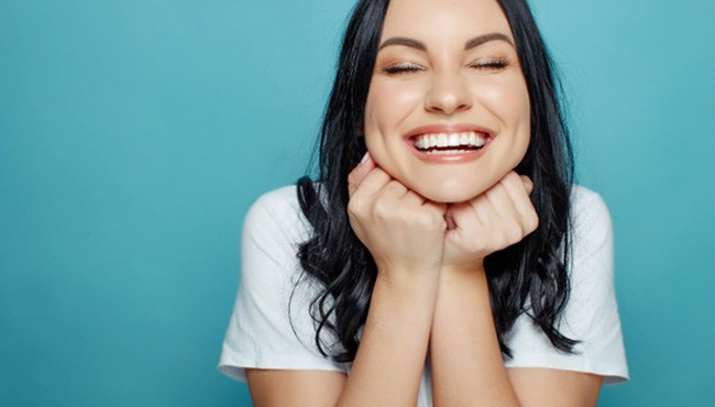 woman smiling after getting teeth whitening in Fort Worth