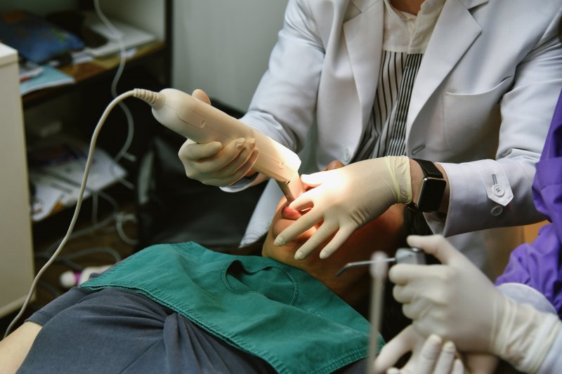 Dentist capturing a digital impression of a patient’s mouth