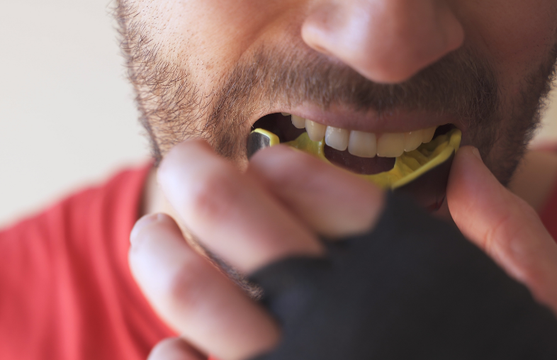 Man putting in mouthguard